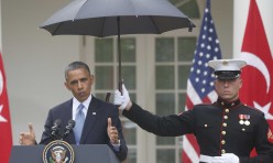 A Marine, an Umbrella, and a Commander-In-Chief